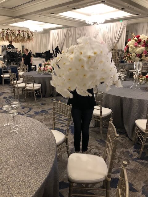 Person Hiding Behind Flowers